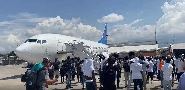 VIDEO: Agents Injured! Haitian Migrants Storm Plane, Hijack Buses
